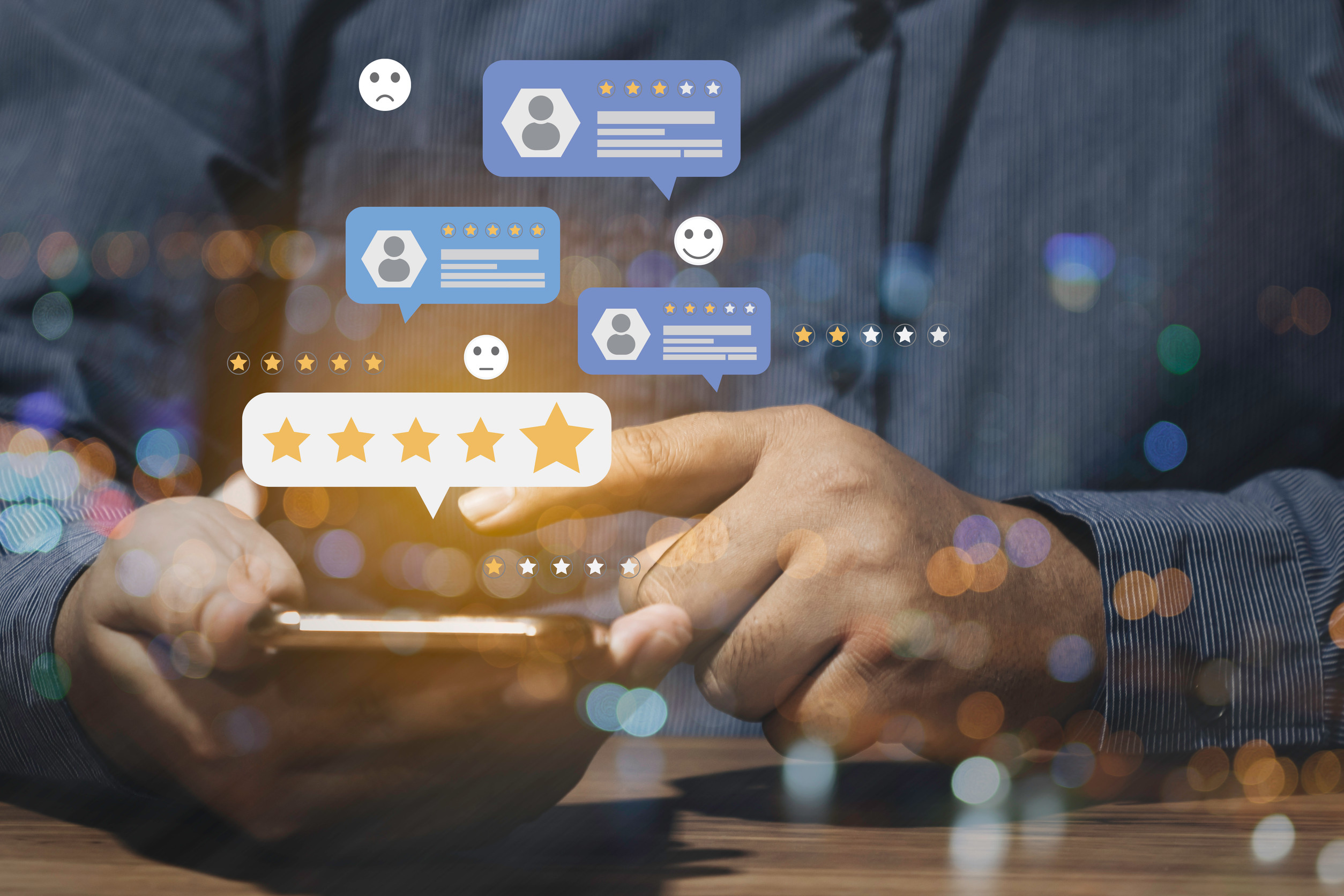 A person using a smartphone, with illustrated speech bubbles, stars, and emoticons floating above the screen, representing powerful online reviews and customer feedback.